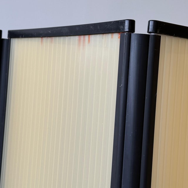 c. 1980s. Corrugated orange plastic with black plastic trim. Attributed to Herman Miller in Michigan. This piece is...