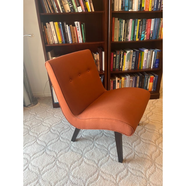 This striking Room & Board armless accent chair is a true design statement, upholstered in a rich terracotta/burnt orange...