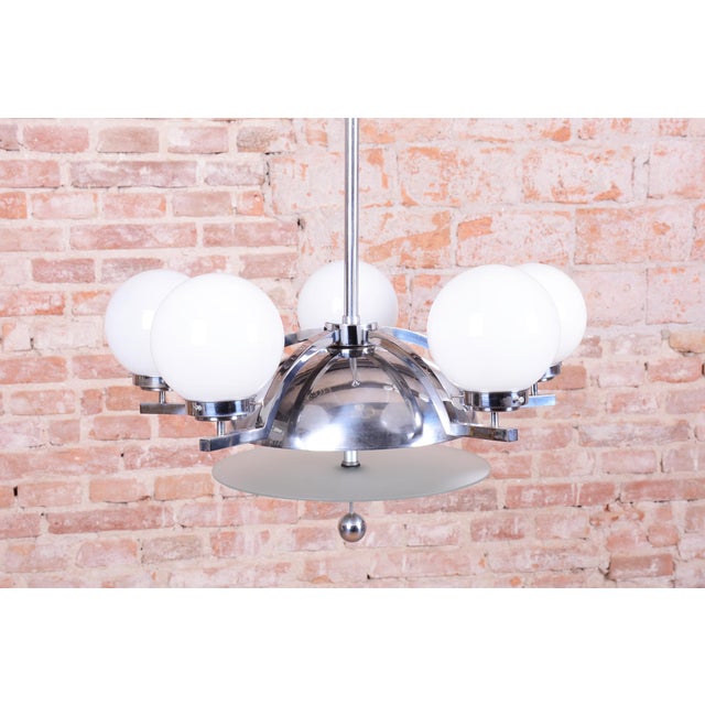 This chandelier is an excellent example of Czechoslovak functionalism and Bauhaus design from the 1930s. The lighting...