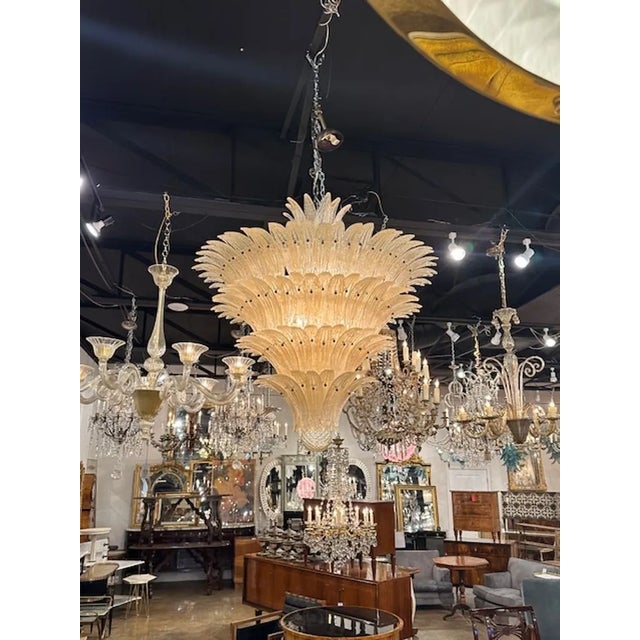 Large scale modern Murano gold granola glass "palm" chandelier. The chandelier has been professionally rewired, comes with...