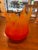 A dramatic hand-blown art-glass vessel by Cohn-Stone Studios, dated 2004. The sculptural form transitions from deep ruby...