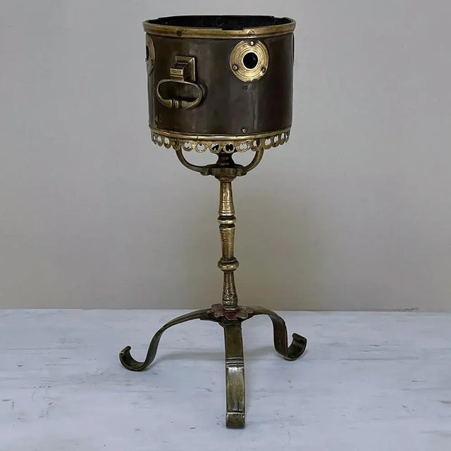 18th Century Dutch Bronze & Copper Tea Kettle Warmer is an intriguing artifact, hand-crafted from bronze and copper to...
