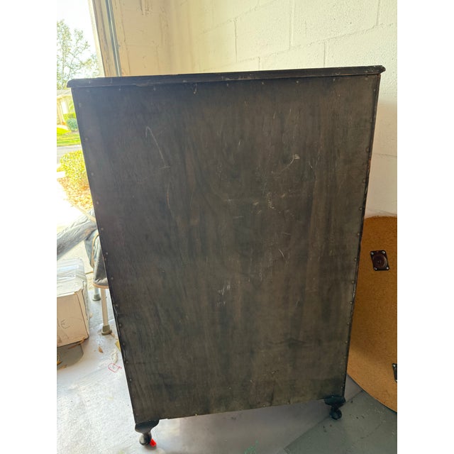 This tallboy cabinet dates to the mid-20th century, approximately 1940s-1950s featuring Queen Anne style elements with its...