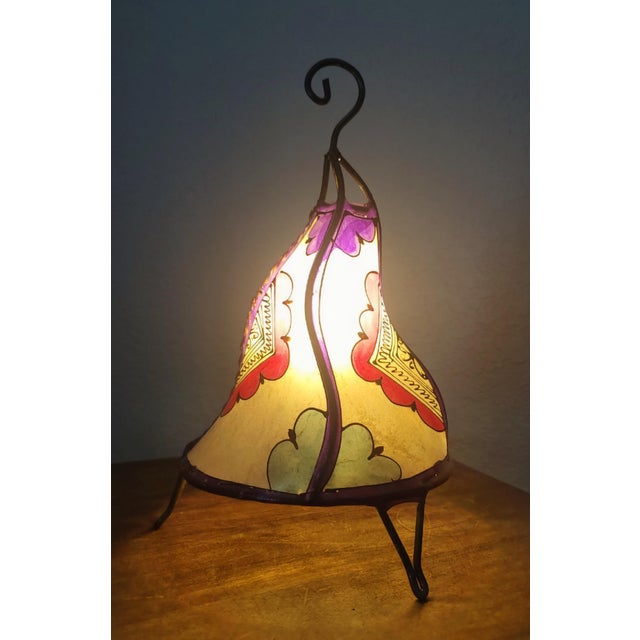 A radiant piece of Moroccan artistry, this handmade henna lamp brings the warmth of the Maghreb into any space. Crafted by...