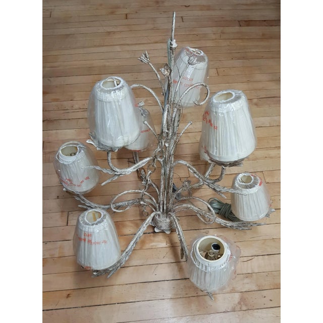 This beautiful Chandelier has never been used. It is a floor sample in our showroom for interior design. It has 9 bulbs...