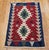 A striking example of traditional Anatolian flatweave artistry, this vintage mid-20th century Turkish kilim features a...