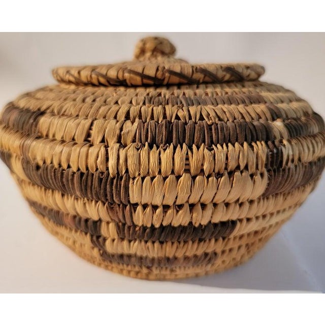 20th C hand woven and dyed Lidded Basket with Geometric Pattern. Great Condition.