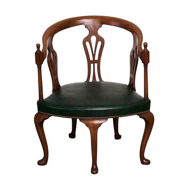 This Edwardian Chair has five cabriolet legs with pad feet. The chair has three pierced splats. The seat is upholstered in...