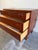 Charming Mid Century Modern Danish chest crafted in warm teak, featuring clean Scandinavian lines and elevated tapered...