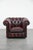 We are offering this timeless and classic cowhide English Chesterfield armchair on casters, finished with decorative...