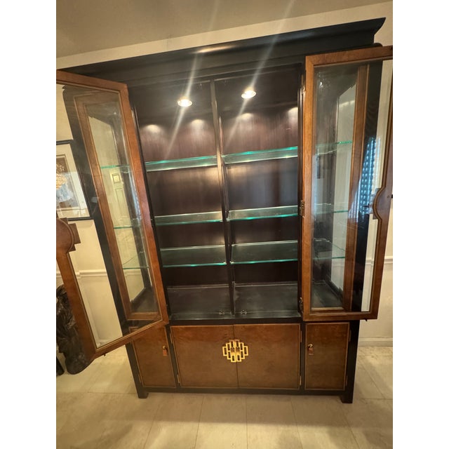 Century Furniture designer Raymond Sobota’s signature Chin Hua dinning room cabinet for displaying various collections....