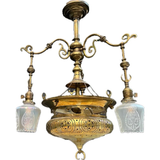 Very unusual vintage Mughal-style brass 4-light down rod chandelier with crescent motif. Features a central pierced-brass...