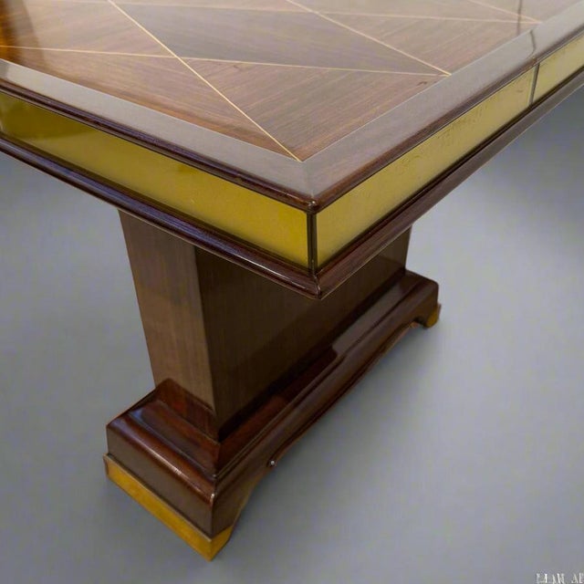 A fine Art Deco cocktail table designed by Jean Desnos. Marquetry patterned top. Table border surrounded by eglomise glass...