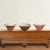 A chic set of three 19th century English glazed terra-cotta dough bowls, two with unglazed exteriors with white crackle...