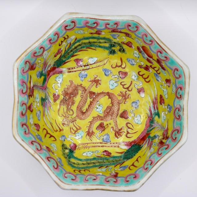 An exceptional antique Chinese porcelain octagonal bowl featuring an intricate dual-narrative design. The exterior is...