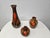 A set of three stunning Dryden Pottery vases with a high-gloss brown, green, and bright burnt orange/red drip glaze. Based...