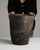 Here is a planter/urn, its dark bronze/black textured patina, tapered round form the first thing to catch the eye. The...