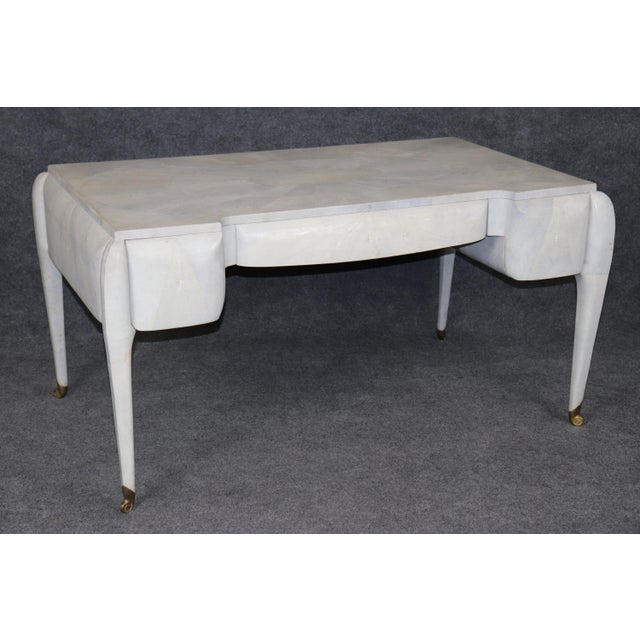 Sophisticated, sculptural, and unmistakably luxurious, this exceptional French Directoire style faux shagreen desk by...