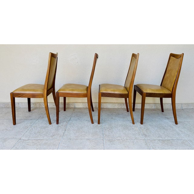 Exquisite set of four dining chairs produced by g-plan, the renowned british manufacturer celebrated for its elegant,...