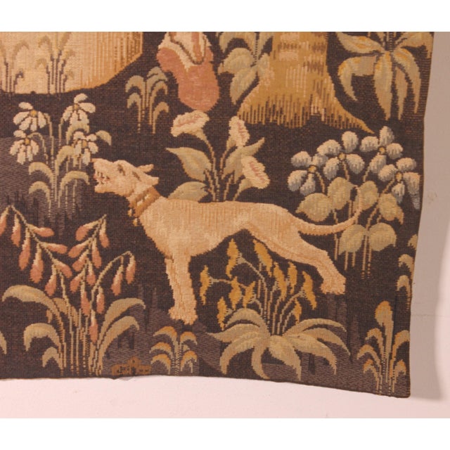 This early 20th-century machine-made tapestry is a reproduction of a renaissance tapestry held at the louvre museum. the...