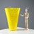 Yellow and colorless blown glass vase with soft, sinuous lines. Manufacturer's mark engraved under the base. Small...