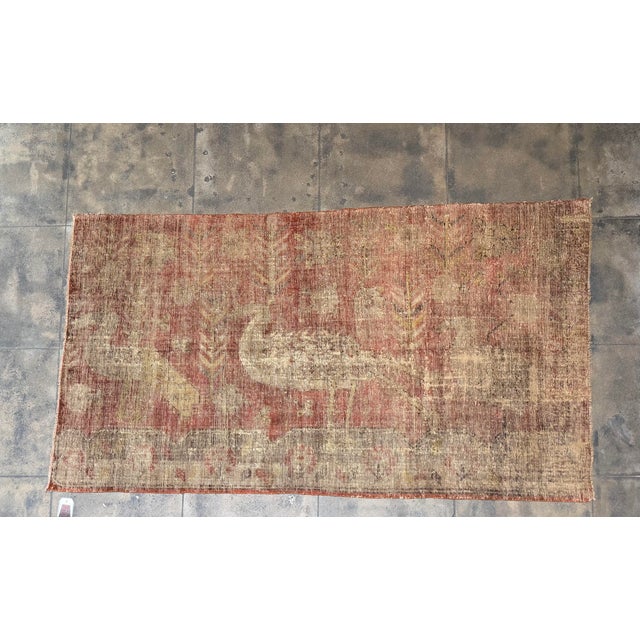 This distinctive antique Samarkand rug, dating to circa 1900, features an intriguing combination of stylized bird-like...