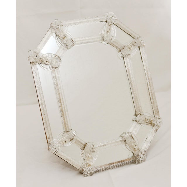 Murano Mirror Venetian mirror, made in the 1930s/40s. Octagonal shape. Clear Murano glass with grooved frame elements....