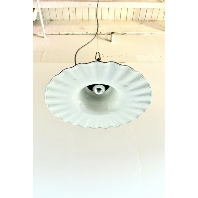 These pendants used to hang over streets and gas stations. Cast iron top and cold pressed enamel copper shade. Completely...