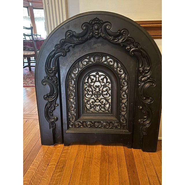 Rare, rounded Victorian black cast iron fireplace cover in perfect condition. It measures 30" wide and 33" tall in the...
