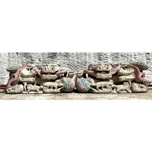 Add an air of exotic elegance to your decor with this captivating pair of Vintage Asian Monumental Hand-Carved Foo Dogs....