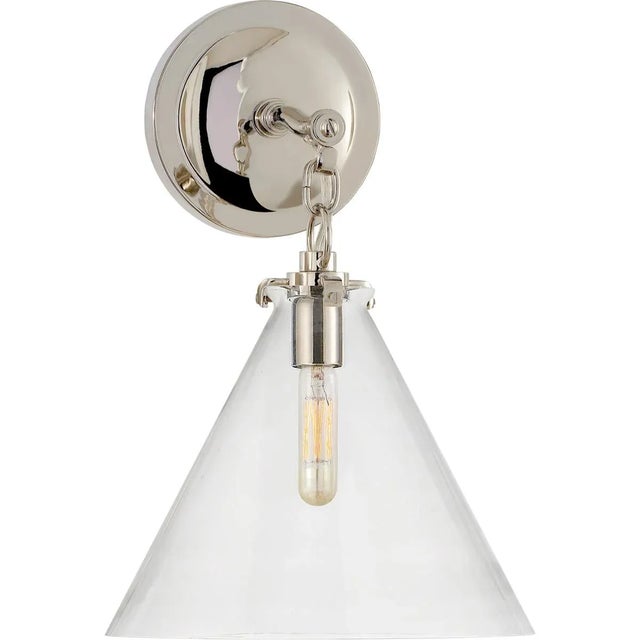 Katie Small Conical Sconce in Polished Nickel with Clear Glass Designer: Thomas O'Brien Height: 14.4" Extension: 10.25"...