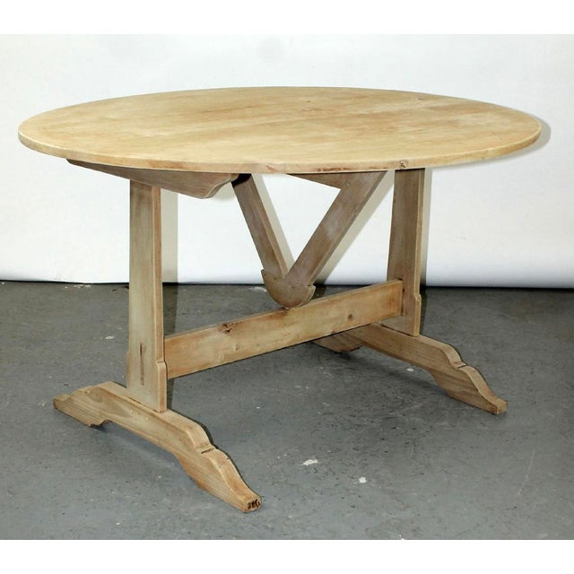 Beautiful tilt top bleached walnut vitner’s table. Late 20th century.