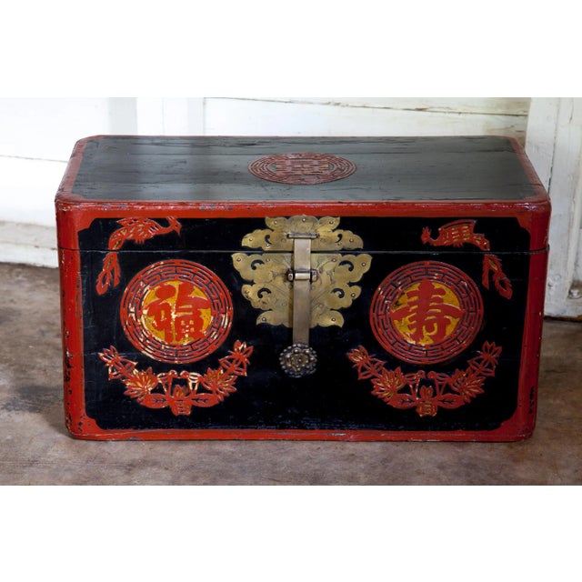 Exquisite antique Chinese chest replete with powerful lacquered scrolling symbolizing happiness, longevity and good...
