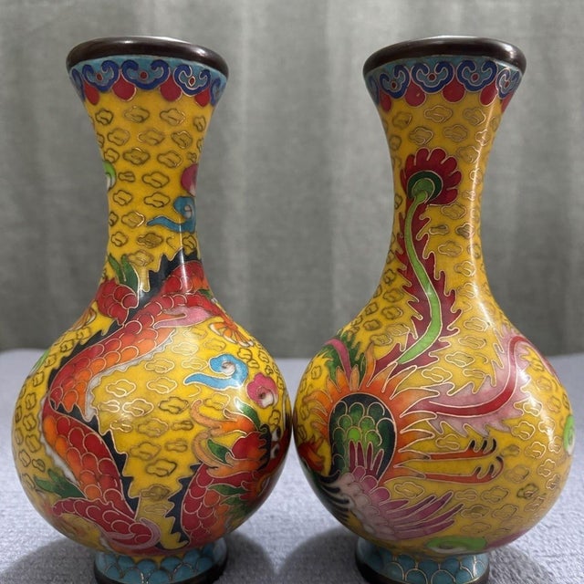 Bring a radiant burst of color and timeless elegance to your home with this exceptional Pair of Vintage Cloisonné Enamel...