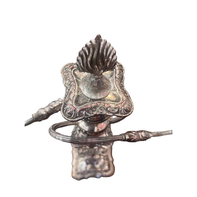 Antique Silver-Plated Metal Candelabrum English silver-plated candelabras manufactured by Rand.
