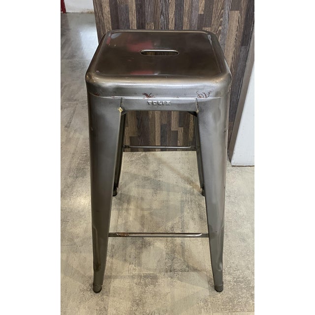 Authentic tolix bar stool designed by xavier pauchard. this h75 stool, with its industrial design and backless...