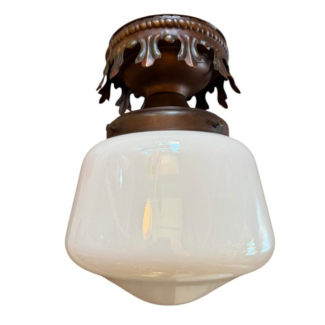 These flush mount fixtures feature antique polychrome painted brass canopies with an Art Deco style and a white opal glass...