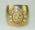 Late 20th Century Gerard Yosca gold plated cuff bracelet with a hammered finish and a regal lion medallion framed in...