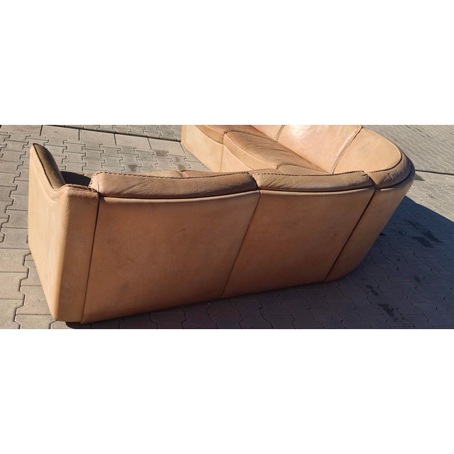 This modular sofa consists of two outer sections, each 140 cm long, and a central corner section that is 60 cm deep. The...