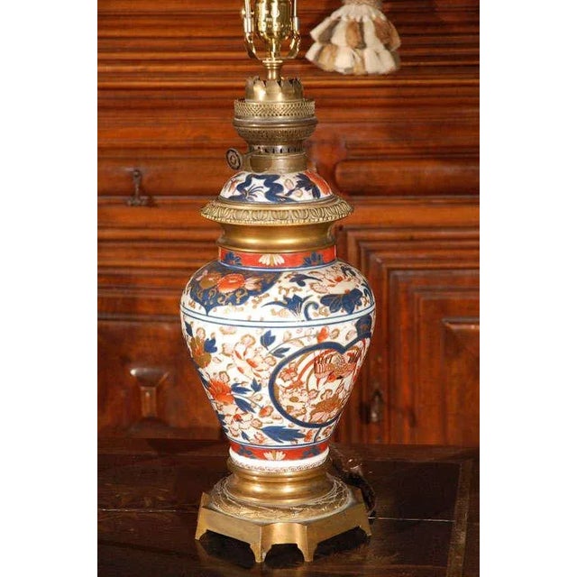 19th century, hand painted porcelain Imari vases, with gilt bronze mounts. Formerly gas-lamps, but wired for export. Rich...