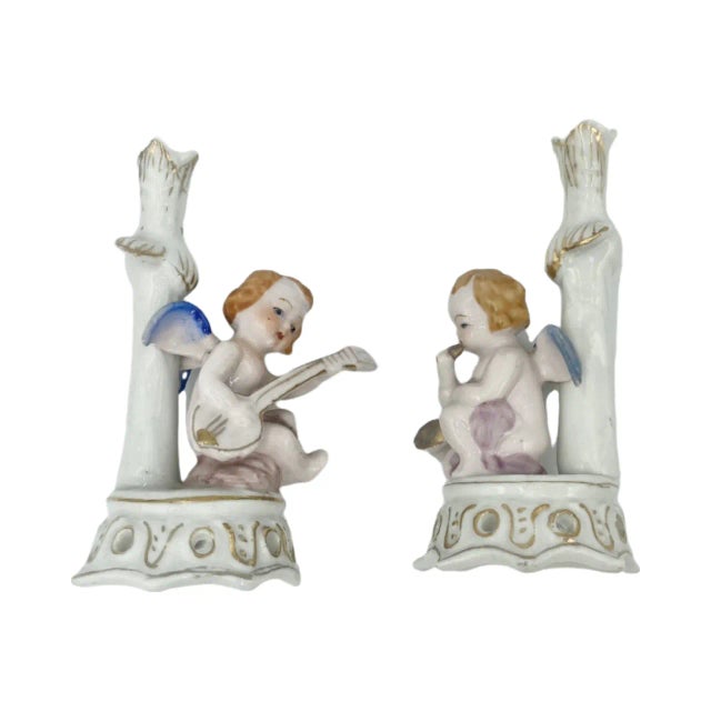 Details: -These charming figurines are perfect for desk or mantle decor! -One figurine is playing a guitar while the other...