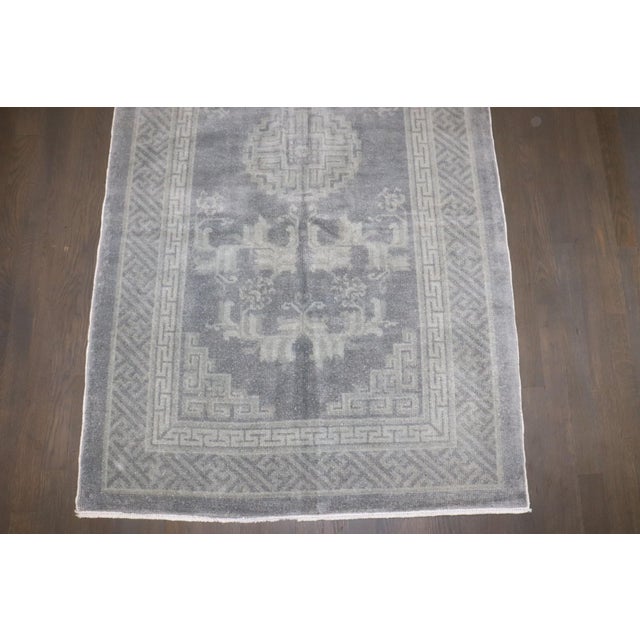 An early 20th Century Chinese Peking in rug in a misty bluiesh gray color