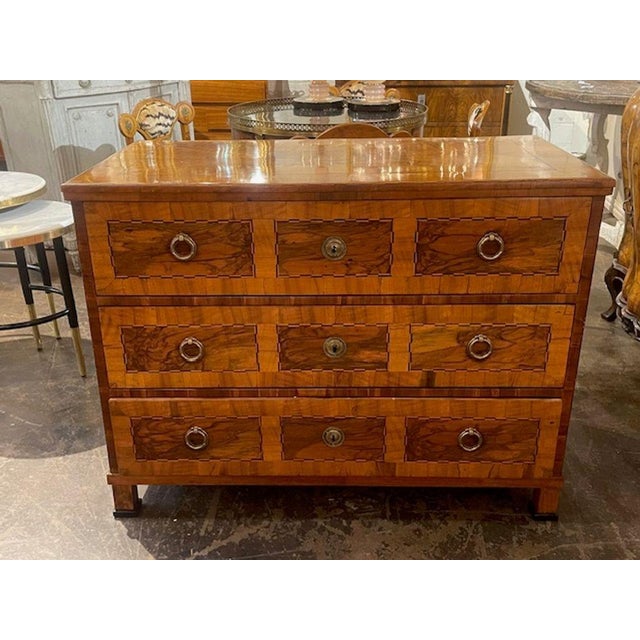 The 19th c. Continental Inlaid Walnut Commode is a stylish and functional piece of furniture. With it's very fine finish...