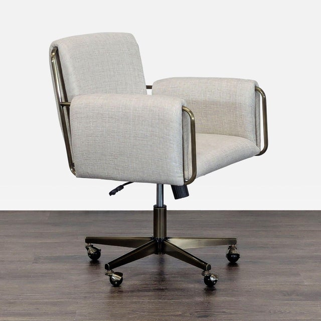 This Crate and Barrel office chair has a modern look with soft, light beige upholstery and a sturdy metal frame. The chair...