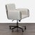 This Crate and Barrel office chair has a modern look with soft, light beige upholstery and a sturdy metal frame. The chair...