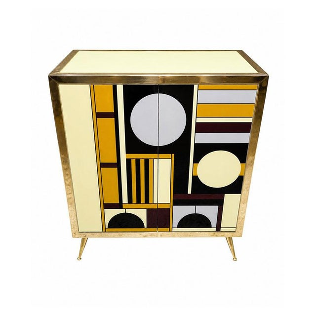 Two-door sideboard, entirely handmade, with a wooden frame covered in multicolored Murano glass; trim, handles, and feet...