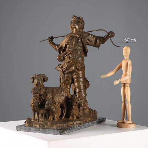 Bronze sculpture on a black marble base depicting a shepherd with herds. The artist's signature, G. Morlaiter, is engraved...