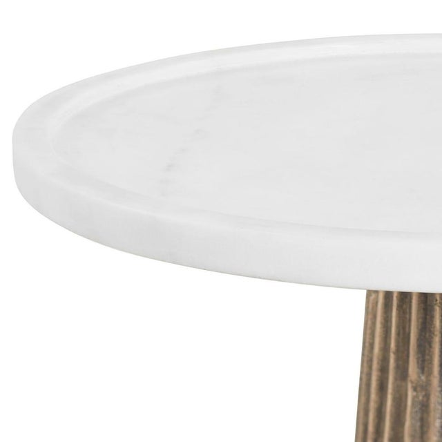 Featuring a beautifully fluted cast aluminum base finished in a warm antique brass, this striking side table brings...