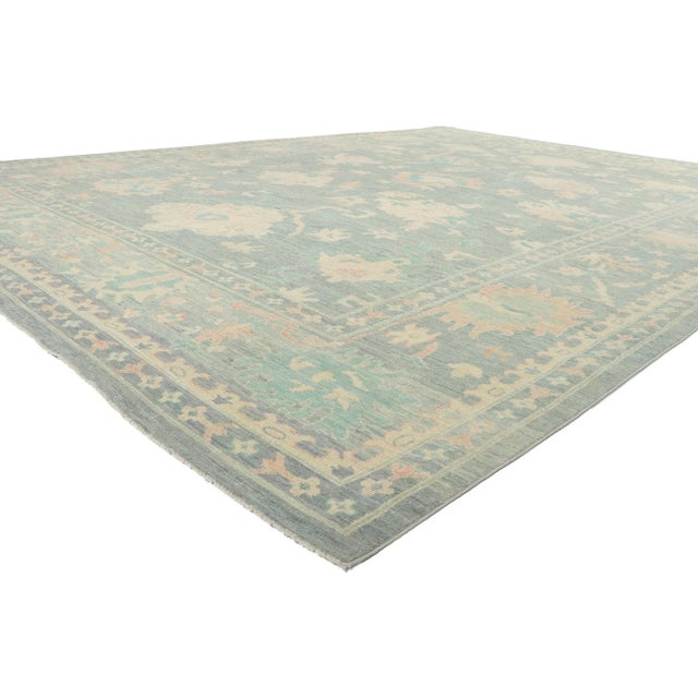Vintage-Inspired Oushak Rug with Modern Style. Serene and sophisticated, this hand-knotted wool vintage-inspired Oushak...