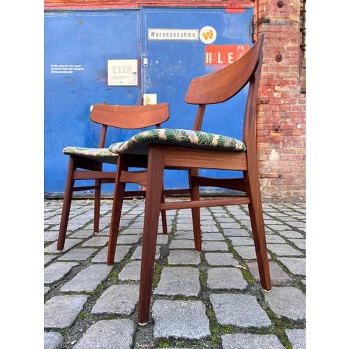 Two classic upholstered chairs from the Danish manufacturer Farstrup, known for its excellent craftsmanship and timeless...